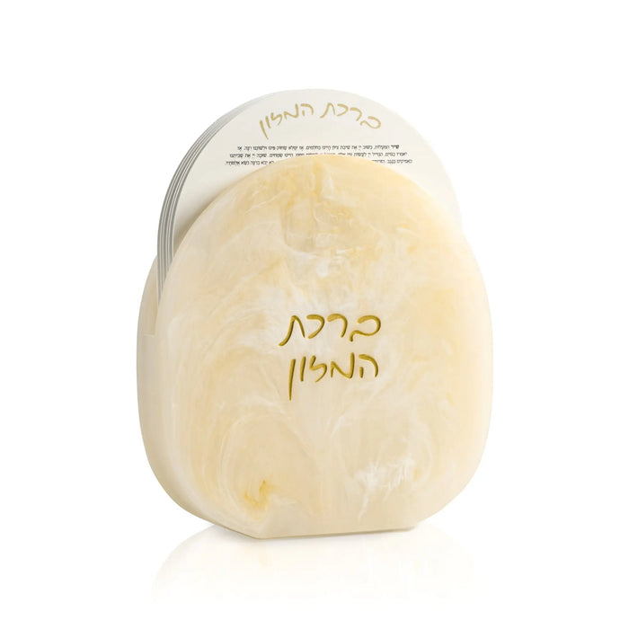 Cream-colored resin bencher set with Hebrew text, elegant tabletop design for Shabbat and holiday entertaining.