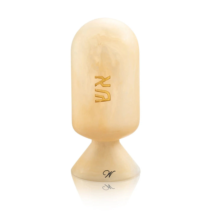Cream-colored resin matzah cloche with gold-tone metal base and interior match storage compartment for Shabbat and holiday entertaining.