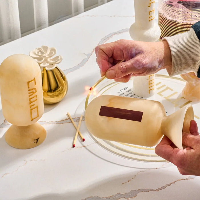 Gold resin match cloche box with metal accents displayed on white surface, ideal for Shabbat and holiday entertaining