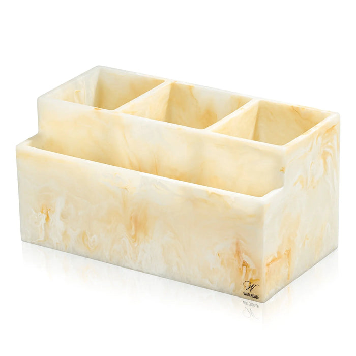 Cream-colored resin silverware caddy with four compartments for organizing utensils on a dining table.