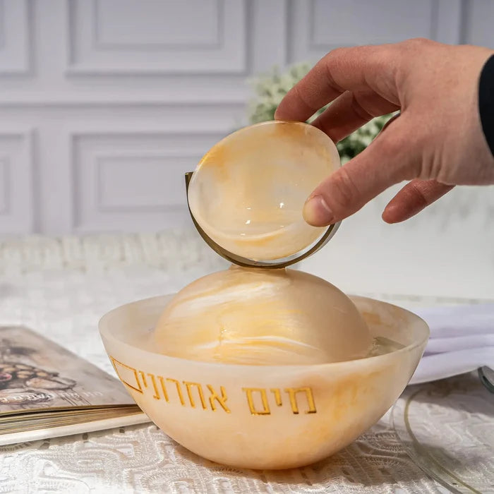 Rotating Resin Mayim Achronim dispenser in gold with matching bowl and leaf-topped lid for Shabbat and holiday table settings.