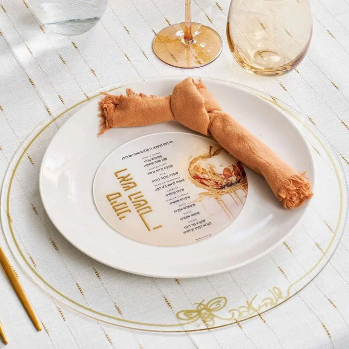 Round Batya painted simanim (סימנים) card on a Rosh Hashana place setting