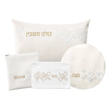 Scattered Fur Pesach Set by Waterdale Collection featuring white leather accessories with gold embroidered details, including pillow, plate, and matching items for holiday table settings.
