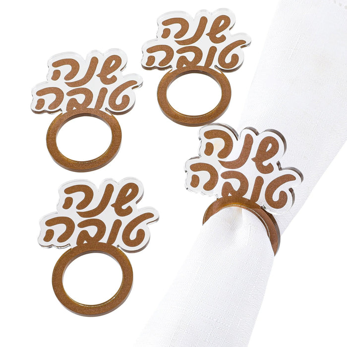 Gold Shana Tova (שנה טובה) napkin rings in Hebrew script, from Waterdale Collection