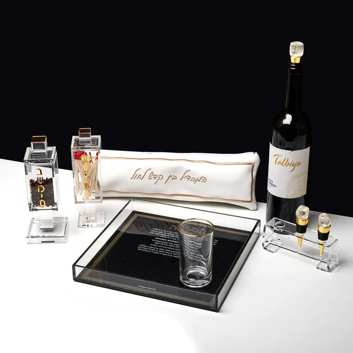 Square black metal besamim holder with spice jar displayed on white surface, perfect for Shabbat and holiday use.