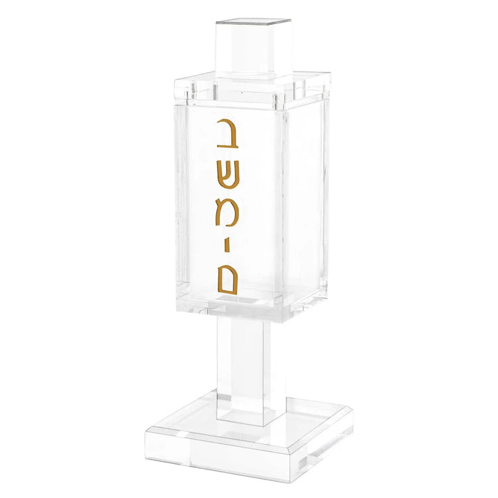 Square metal Besamim holder with gold lettering on clear glass jar, sitting on rectangular base for Shabbat spice container.