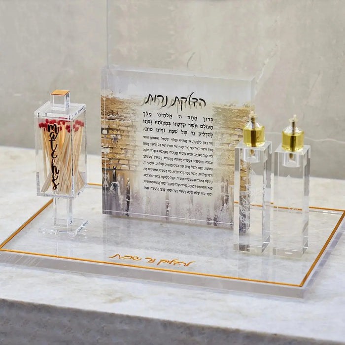 Clear acrylic square match holder by Waterdale Collection displayed with decorative matches and candles for Shabbat and holiday candle-lighting occasions.