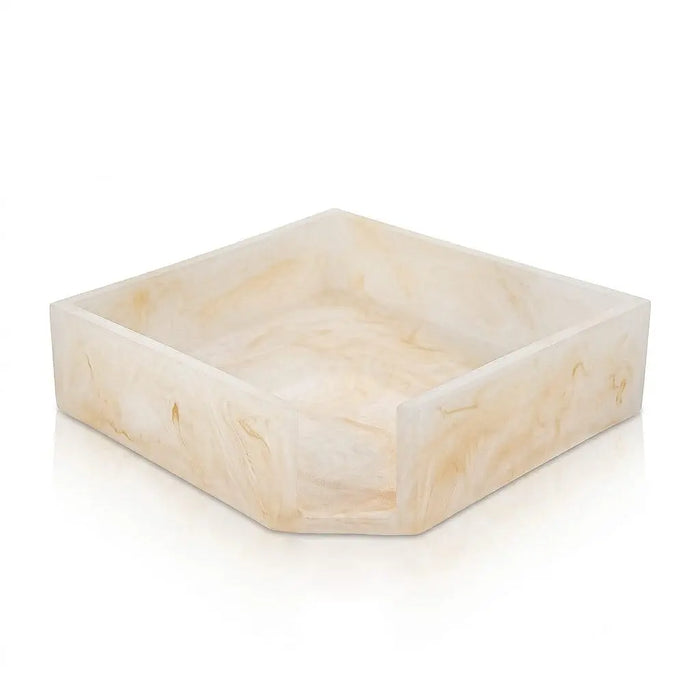 Square cream-colored resin napkin holder with natural stone-like texture, perfect for Pesach tabletop entertaining