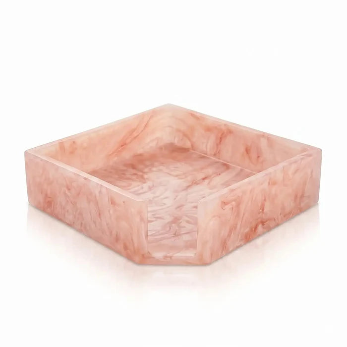 Square resin napkin holder in blush pink with marbled texture, perfect for Pesach tableware and holiday entertaining.