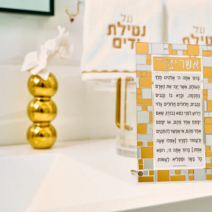 Gold stacked bubble flower diffuser by Waterdale Collection with holiday greeting cards displayed on white shelf