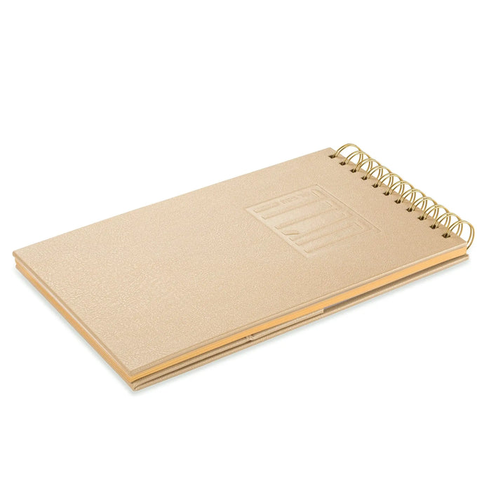 Tan leather Standing Haggadah with spiral binding and embossed cover design for Passover table use.