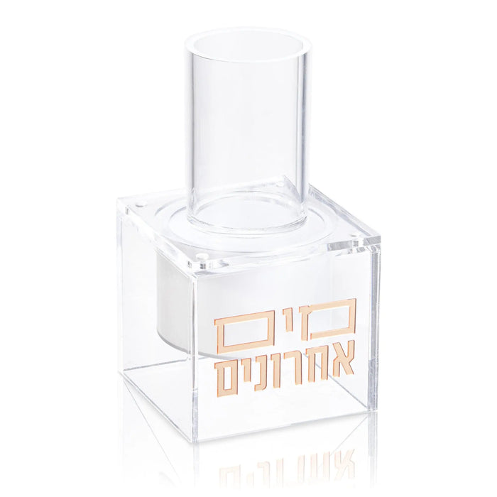 Clear acrylic suspended mayim achronim dispenser with rose gold accents and interior compartment for elegant tabletop display.