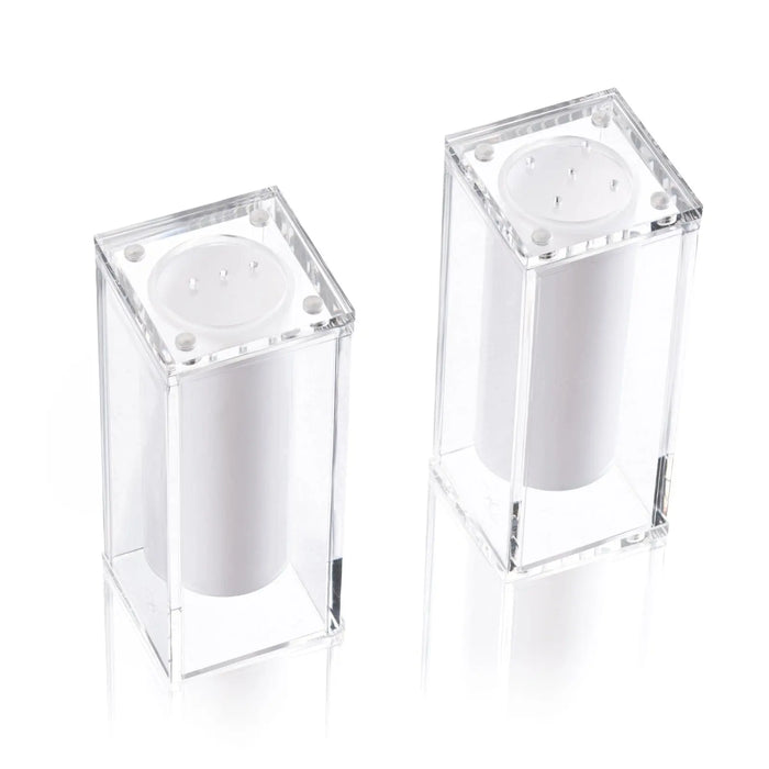 Two clear acrylic suspended salt shakers with silver metal tops from Waterdale Collection's elegant tabletop collection.