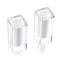 Two clear acrylic suspended salt shakers with silver metal tops from Waterdale Collection's elegant tabletop collection.