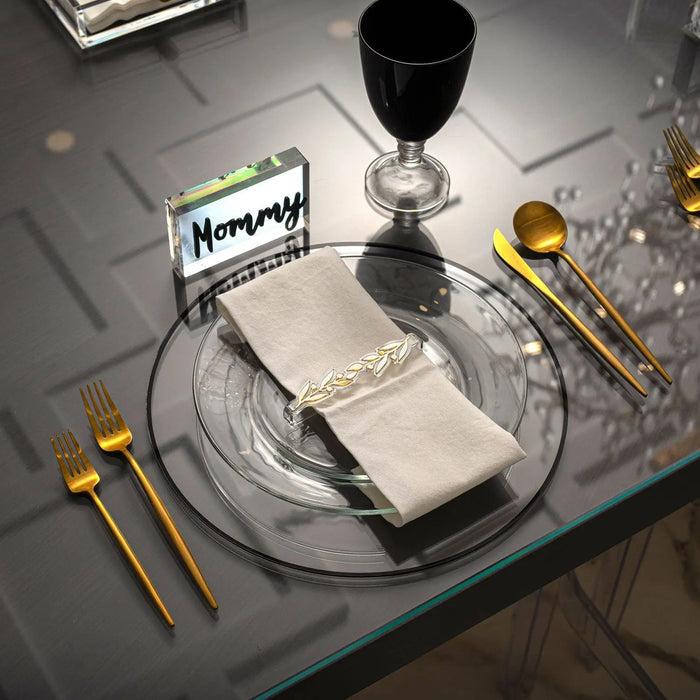Black Thin Border Charger plate by Waterdale Collection displayed on a formal place setting with wine glass and gold cutlery.