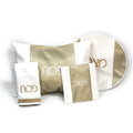 Gold and white leather Pesach set with three sections displayed with matching accessories on white background