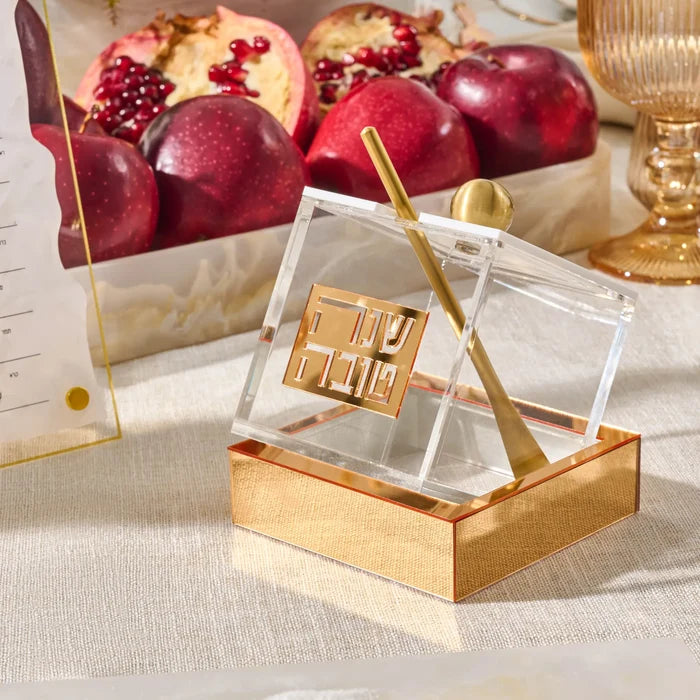 Tilt Lucite honey dish angled in its base for a Rosh Hashana table