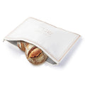 White and gold leather Trinket Challah Pouch Cover with a fresh challah loaf partially visible inside, perfect for Shabbat table settings.