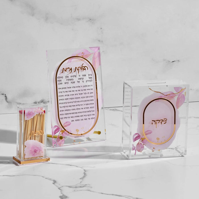 Watercolor Hadlokas Neiros gift box set with pink floral design, includes candle lighting card and matches in clear acrylic packaging for Shabbat.