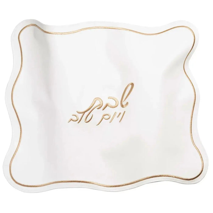 Cream leather wavy challah cover with gold embroidered text detail by Waterdale Collection for Shabbat table.