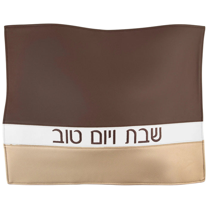 Brown and tan leather horizontal challah cover with Hebrew text, featuring a two-tone design for Shabbat table.