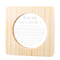 Wood Shema lamp with cream circular shade featuring Hebrew text, mounted on light pine wooden base with vertical grain detail.
