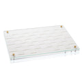 Woven challah board with white woven pattern and leather corner accents, displayed at an angle against a white background.