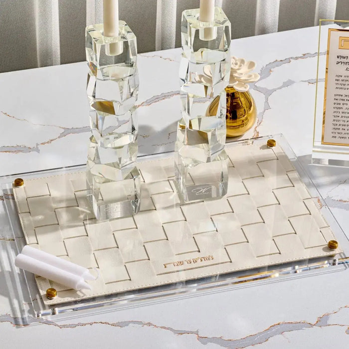 Woven Hadlokas Neiros Set with pearl marble candlesticks and glass bottles arranged on white marble tray with styling accessories