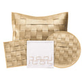 Woven leather Pesach set in gold and white featuring matching plate, matzah cover, and round ceremonial dish with interlocking square pattern design.
