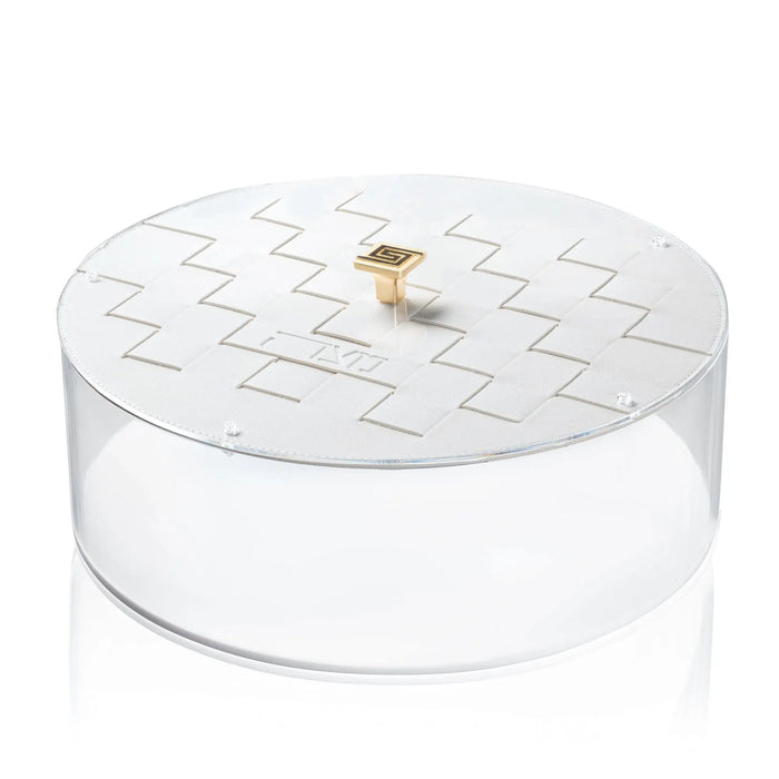 Woven Matzah Box with white lucite base and woven pattern lid, topped with small gold ornament, Pesach tabletop storage.