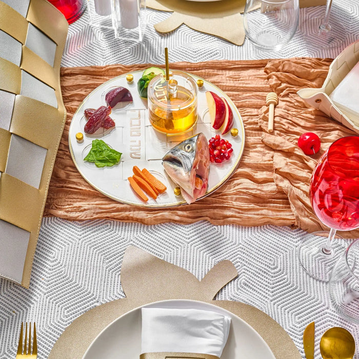Woven leather simanim (סימנים) tray styled with the Rosh Hashana foods