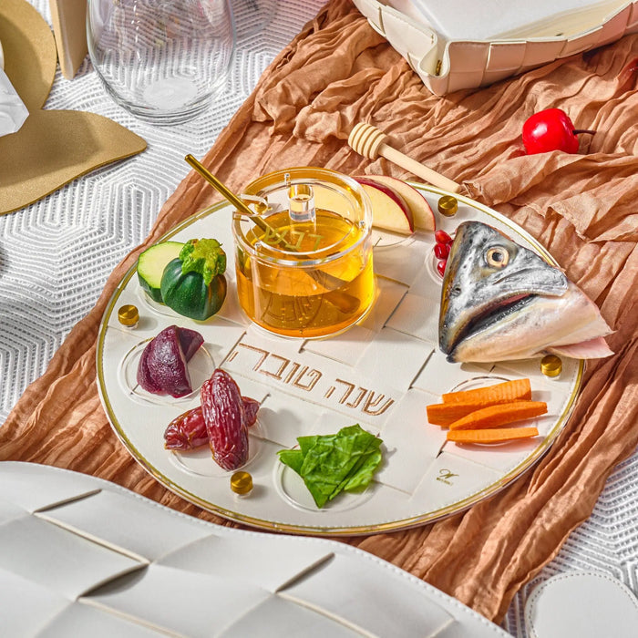Woven leather Jewish New Year simanim platter on a holiday table (ראש השנה)
